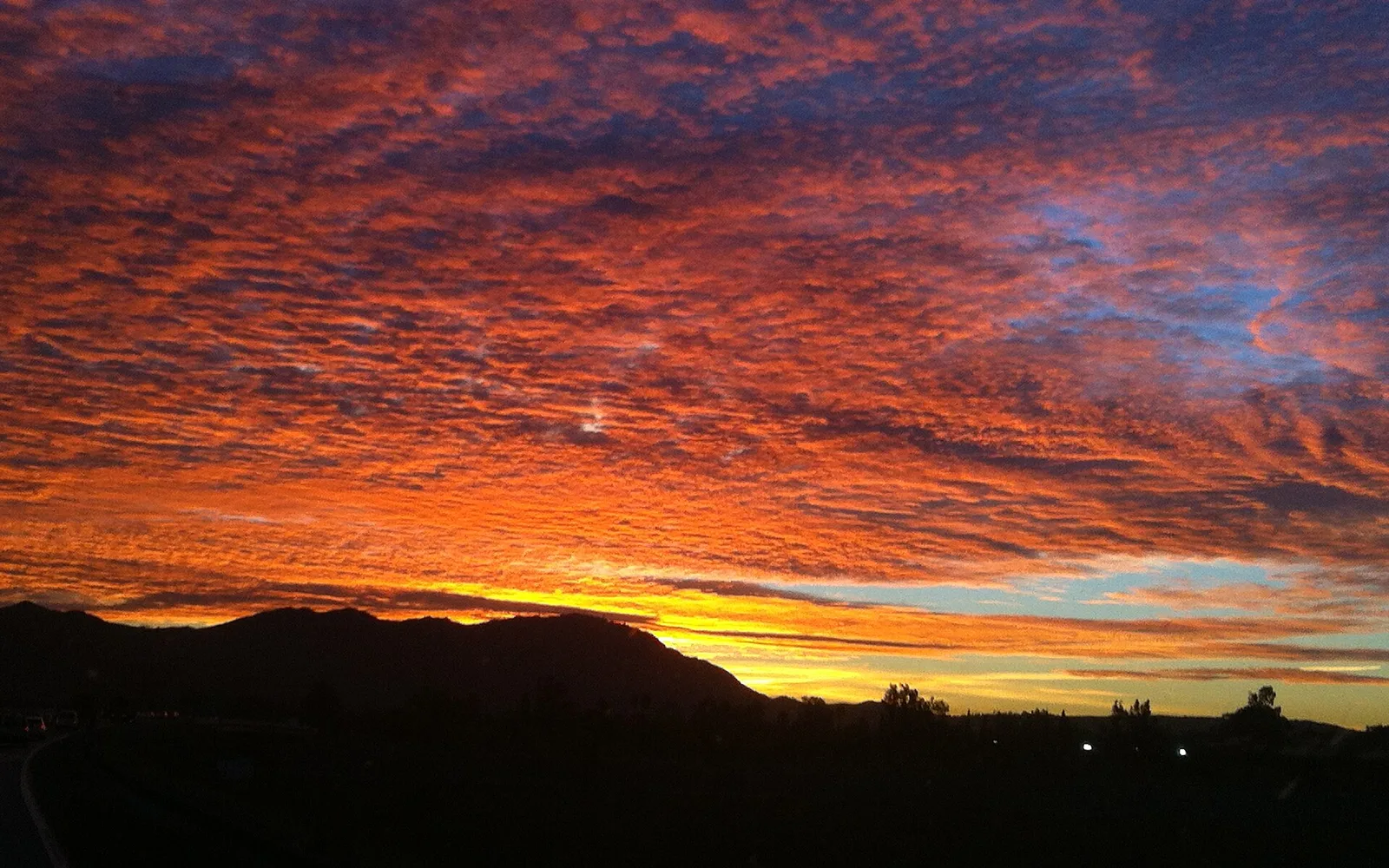 Sunrise over the silhouette of Box Springs Mountain in Riverside County.